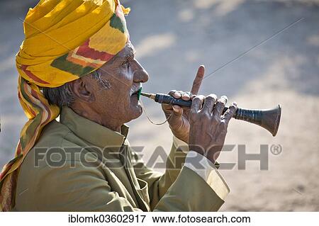 "Flute player wearing a yellow turban, Mehrangarh Fort, Jodhpur, Rajasthan, India, Asia" View Large Photo Image Stock Photo - "Flute player wearing a yellow turban, Mehrangarh Fort, Jodhpur, Rajasthan, India, Asia". Fotosearch