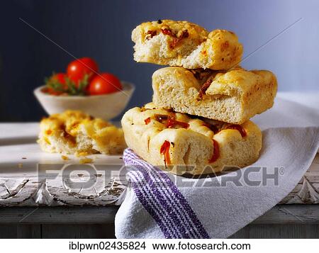 Focaccia Italian bread with sun-dried tomatoes View Large Photo Image Picture - Focaccia Italian bread with sun-dried tomatoes. Fotosearch