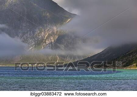 "Fog moving over a fjord near Flakstad, Vareid at the back, Flakstadoy, Lofoten, Nordland, Norway, Europe" View Large Photo Image Stock Image - "Fog moving over a fjord near Flakstad, Vareid at the back, Flakstadoy, Lofoten, Nordland, Norway, Europe". Fotosearch