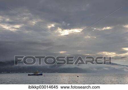 "Fog over the Highlands and a boat on Loch Duich after strong rain, Dornie, Highlands, Scotland, United Kingdom, Europe" View Large Photo Image Stock Photography - "Fog over the Highlands and a boat on Loch Duich after strong rain, Dornie, Highlands, Scotland, United Kingdom, Europe". Fotosearch