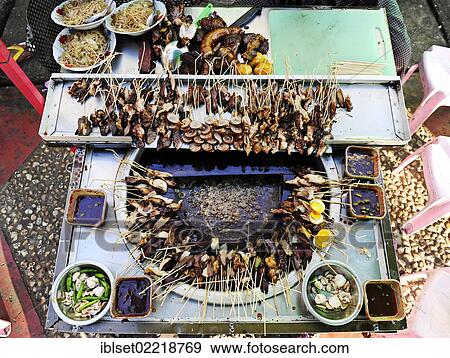 Stock Photo - "Food stall offering skewers in Yangon, Burma also known as Myanmar, Southeast Asia, Asia". Fotosearch