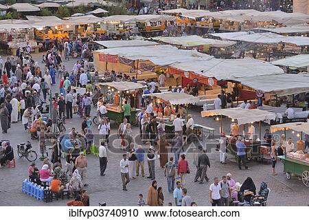 Stock Image - "Food stalls at Djemaa el Fna market square, Marrakesh, Marrakesh-Tensift-El Haouz region, Morocco, Africa". Fotosearch