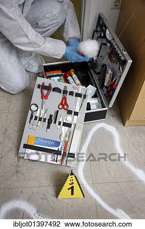 "Forensic's case, officer of the C. I. D., the Criminal Investigation Department, gathering forensic evidence at the scene of a crime, after a capital offence, homicide, re-enacted scene" View Large Photo Image Stock Image - "Forensic's case, officer of the C. I. D., the Criminal Investigation Department, gathering forensic evidence at the scene of a crime, after a capital offence, homicide, re-enacted scene". Fotosearch
