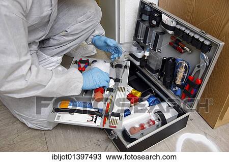 "Forensic's case, officer of the C. I. D., the Criminal Investigation Department, gathering forensic evidence at the scene of a crime, after a capital offence, homicide, re-enacted scene" View Large Photo Image Stock Image - "Forensic's case, officer of the C. I. D., the Criminal Investigation Department, gathering forensic evidence at the scene of a crime, after a capital offence, homicide, re-enacted scene". Fotosearch