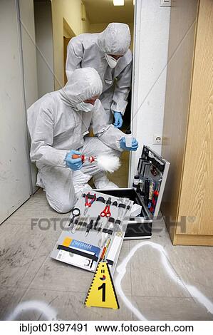 "Forensic's case, officers of the C. I. D., the Criminal Investigation Department, gathering forensic evidence at the scene of a crime, after a capital offence, homicide, re-enacted scene" View Large Photo Image Stock Image - "Forensic's case, officers of the C. I. D., the Criminal Investigation Department, gathering forensic evidence at the scene of a crime, after a capital offence, homicide, re-enacted scene". Fotosearch
