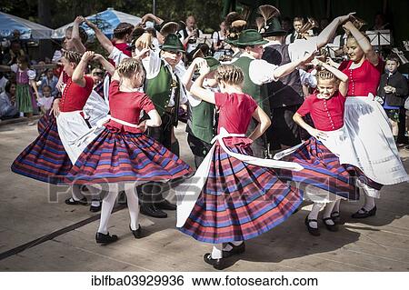 Stock Photograph - "Forest festival of FC Real Kreuth at Leonhardstoana Hof, children of a traditional costume and Plattler group performing, Kreuth, Upper Bavaria, Bavaria, Germany, Europe". Fotosearch