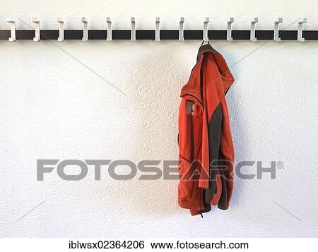 Forgotten jacket hanging on a coatrack View Large Photo Image Stock Photograph - Forgotten jacket hanging on a coatrack. Fotosearch