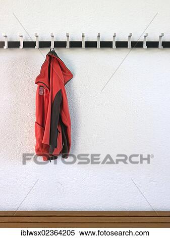 Stock Photography - Forgotten jacket hanging on a coatrack. Fotosearch
