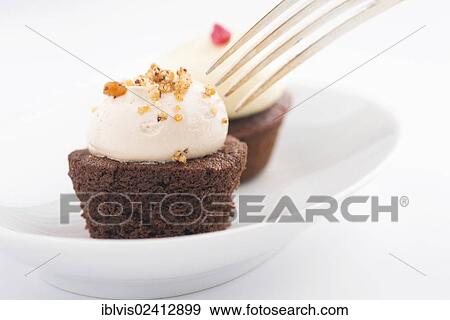 Fork digging in on cupcake View Large Photo Image Stock Photo - Fork digging in on cupcake. Fotosearch