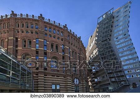 "Former Gasometer from 1896, since 2001 a shopping centre and apartments with a connection to a modern apartment building, Guglgasse, Vienna, Vienna State, Austria, Europe" View Large Photo Image Stock Photo - "Former Gasometer from 1896, since 2001 a shopping centre and apartments with a connection to a modern apartment building, Guglgasse, Vienna, Vienna State, Austria, Europe". Fotosearch