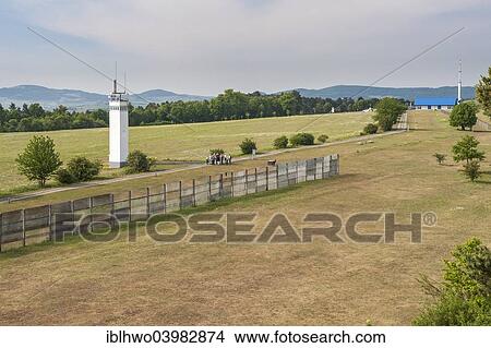 Picture - "Former inner German border, death zone, patrol path, observation tower and border fence, """"House on the Border"""" at the back, memorial and museum, Point Alpha Memorial, Rasdorf, Rhon Mountains, Hesse, Germany, Europe". Fotosearch