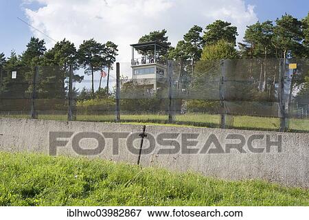 Stock Photo - "Former inner German border, death zone, border fence and car ditch, American observation tower at the back, now memorials and museums, Point Alpha Memorial, Geisa, Rhon Mountains, Thuringia, Germany, Europe". Fotosearch
