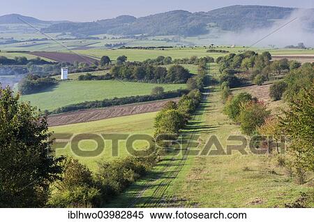 "Former inner German border, death zone with patrol path, observation tower, mist, near Point Alpha Memorial, Rasdorf, Rhon Mountains, Hesse, Germany, Europe" View Large Photo Image Stock Photography - "Former inner German border, death zone with patrol path, observation tower, mist, near Point Alpha Memorial, Rasdorf, Rhon Mountains, Hesse, Germany, Europe". Fotosearch