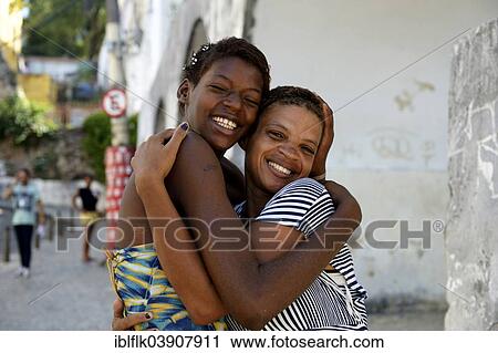 "Former street child, girl, 15, hugging her mother, Lapa district, Rio de Janeiro, Rio de Janeiro State, Brazil, South America" View Large Photo Image Stock Image - "Former street child, girl, 15, hugging her mother, Lapa district, Rio de Janeiro, Rio de Janeiro State, Brazil, South America". Fotosearch