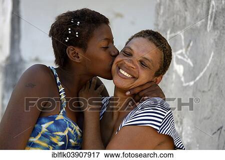 "Former street child, girl, 15, hugging her mother, Lapa district, Rio de Janeiro, Rio de Janeiro State, Brazil, South America" View Large Photo Image Stock Photo - "Former street child, girl, 15, hugging her mother, Lapa district, Rio de Janeiro, Rio de Janeiro State, Brazil, South America". Fotosearch