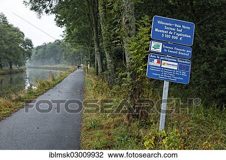 "Former towpath, now a paved cycle path along the Canal des Vosges, formerly Canal de l'Est, at Les Forges d'Uzemain, Uzemain, Epinal, Lorraine, Departement Vosges, France, Europe" View Large Photo Image Stock Image - "Former towpath, now a paved cycle path along the Canal des Vosges, formerly Canal de l'Est, at Les Forges d'Uzemain, Uzemain, Epinal, Lorraine, Departement Vosges, France, Europe". Fotosearch