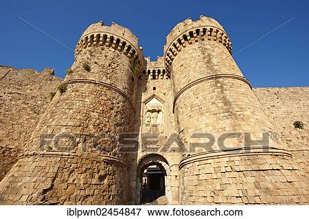 Stock Photo - "Fortified medieval gates to the old town of Rhodes, Greece, Europe". Fotosearch