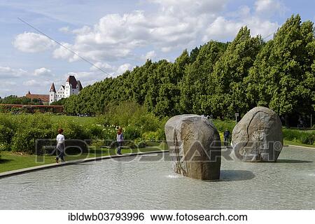 Stock Photograph - "Fountain sculpture with three boulders, Edwert Hilgemann, 1990 - 1992, New Castle seen from Klenzepark, Ingolstadt, Upper Bavaria, Bavaria, Germany, Europe". Fotosearch