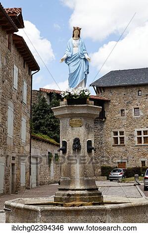 Stock Photograph - "Fountain, Virgin statue, Malzieu Ville, Gevaudan, Margeride, Lozere, France, Europe". Fotosearch