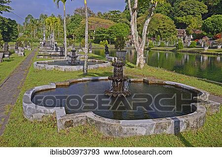 "Fountains and water basins at the Tirta Gangga Water Temple, Bali, Indonesia, Asia" View Large Photo Image Stock Image - "Fountains and water basins at the Tirta Gangga Water Temple, Bali, Indonesia, Asia". Fotosearch