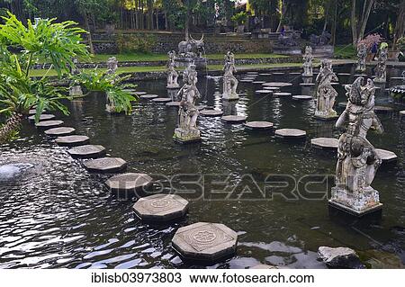 "Fountains and water basins at the Tirta Gangga Water Temple, Bali, Indonesia, Asia" View Large Photo Image Stock Image - "Fountains and water basins at the Tirta Gangga Water Temple, Bali, Indonesia, Asia". Fotosearch