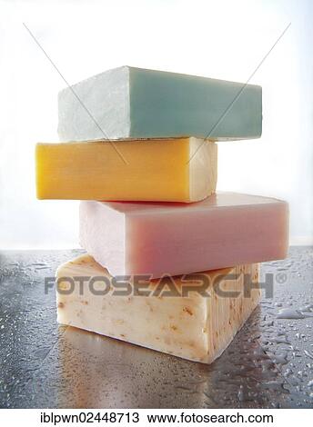 Four bars of scented hand-made soaps piled on aluminium with water droplets View Large Photo Image Stock Image - Four bars of scented hand-made soaps piled on aluminium with water droplets. Fotosearch