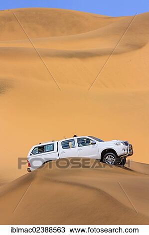 Stock Image - "Four-by-four, Namib Desert, Namib-Naukluft National Park, Namibia, Africa". Fotosearch