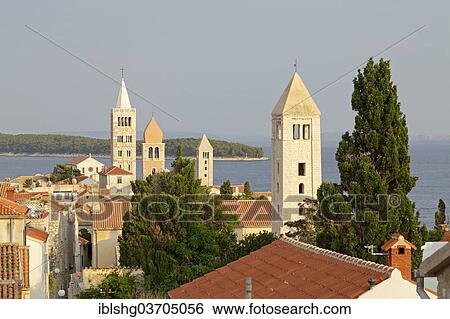 Stock Photograph - "Four church steeples above the roofs of the historic town centre, Rab, Rab, Primorje-Gorski Kotar, Croatia, Europe". Fotosearch