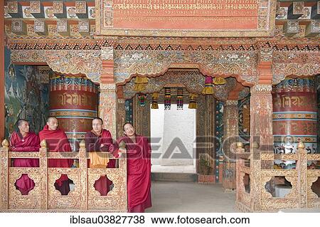 "Four monks in red robes, ornate wooden wall, Buddhist Tango Goemba Monastery near Thimphu, Kingdom of Bhutan" View Large Photo Image Stock Photo - "Four monks in red robes, ornate wooden wall, Buddhist Tango Goemba Monastery near Thimphu, Kingdom of Bhutan". Fotosearch