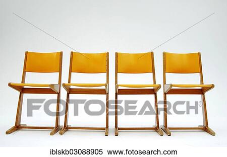 Four old orange school chairs standing side by side View Large Photo Image Stock Photography - Four old orange school chairs standing side by side. Fotosearch