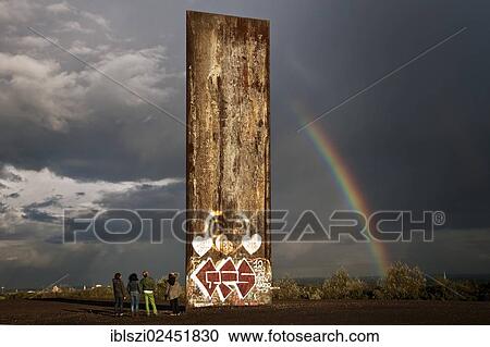 "Four people standing next to the steel slab on Schurenbachhalde, a former spoil tip, with a rainbow, Essen, North Rhine-Westphalia, Germany, Europe, PublicGround, Europe" View Large Photo Image Stock Image - "Four people standing next to the steel slab on Schurenbachhalde, a former spoil tip, with a rainbow, Essen, North Rhine-Westphalia, Germany, Europe, PublicGround, Europe". Fotosearch