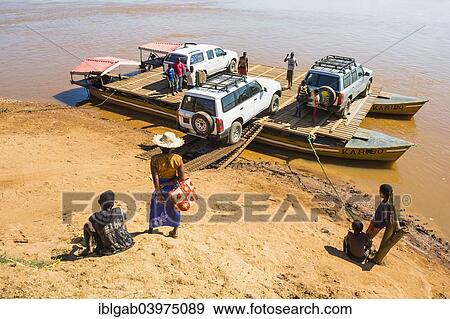 "Four wheel drive car being loaded onto a ferry, near Belon'i Tsiribihina, Morondava, Toliara province, Madagascar, Africa" View Large Photo Image Stock Photo - "Four wheel drive car being loaded onto a ferry, near Belon'i Tsiribihina, Morondava, Toliara province, Madagascar, Africa". Fotosearch