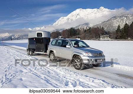 "Four wheel drive vehicle towing a horse trailer on a snow-covered road in the mountains, Gnadenwald, North Tyrol, Austria, Europe" View Large Photo Image Picture - "Four wheel drive vehicle towing a horse trailer on a snow-covered road in the mountains, Gnadenwald, North Tyrol, Austria, Europe". Fotosearch