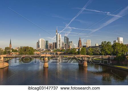 "Frankfurt skyline in the morning light, with the Ignatz Bubis bridge over the Main river at front, Innenstadt/Mainufer, Frankfurt am Main, Hesse, Germany, Europe" View Large Photo Image Stock Photo - "Frankfurt skyline in the morning light, with the Ignatz Bubis bridge over the Main river at front, Innenstadt/Mainufer, Frankfurt am Main, Hesse, Germany, Europe". Fotosearch