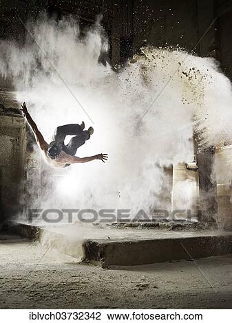 "Free Runner performing a Sideflip, with flour dust, Parkour, Bavaria, Germany, Europe" View Large Photo Image Stock Image - "Free Runner performing a Sideflip, with flour dust, Parkour, Bavaria, Germany, Europe". Fotosearch