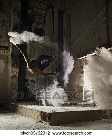 "Free Runner performing a Sideflip, with flour dust, Parkour, Bavaria, Germany, Europe" View Large Photo Image Stock Image - "Free Runner performing a Sideflip, with flour dust, Parkour, Bavaria, Germany, Europe". Fotosearch