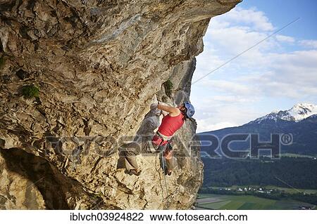 "Freeclimber with helmet climbing on a rock face, Martinswand, gallery, Innsbruck, Tyrol, Austria, Europe" View Large Photo Image Stock Image - "Freeclimber with helmet climbing on a rock face, Martinswand, gallery, Innsbruck, Tyrol, Austria, Europe". Fotosearch