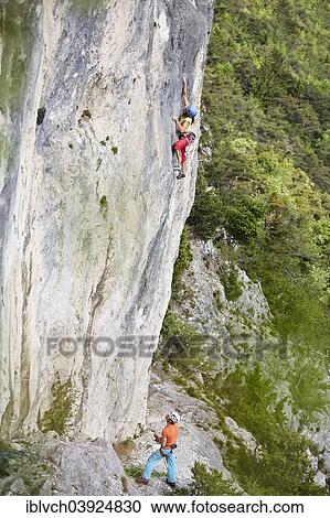 "Freeclimber with helmet climbing on a rock face, Martinswand, gallery, Innsbruck, Tyrol, Austria, Europe" View Large Photo Image Stock Image - "Freeclimber with helmet climbing on a rock face, Martinswand, gallery, Innsbruck, Tyrol, Austria, Europe". Fotosearch