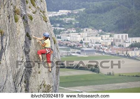 "Freeclimber with helmet climbing on a rock face, Martinswand, gallery, Innsbruck, Tyrol, Austria, Europe" View Large Photo Image Stock Photo - "Freeclimber with helmet climbing on a rock face, Martinswand, gallery, Innsbruck, Tyrol, Austria, Europe". Fotosearch