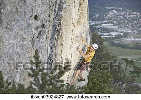 "Freeclimber with helmet climbing on a rock face, Martinswand, gallery, Innsbruck, Tyrol, Austria, Europe" View Large Photo Image Stock Photo - "Freeclimber with helmet climbing on a rock face, Martinswand, gallery, Innsbruck, Tyrol, Austria, Europe". Fotosearch