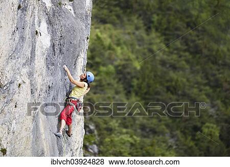 "Freeclimber with helmet climbing on a rock face, Martinswand, gallery, Innsbruck, Tyrol, Austria, Europe" View Large Photo Image Stock Photo - "Freeclimber with helmet climbing on a rock face, Martinswand, gallery, Innsbruck, Tyrol, Austria, Europe". Fotosearch