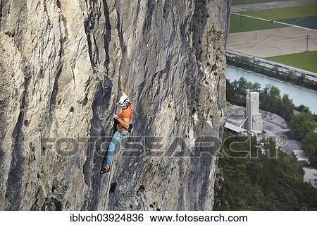 "Freeclimber with helmet climbing on a rock face, Martinswand, gallery, Innsbruck, Tyrol, Austria, Europe" View Large Photo Image Stock Photograph - "Freeclimber with helmet climbing on a rock face, Martinswand, gallery, Innsbruck, Tyrol, Austria, Europe". Fotosearch