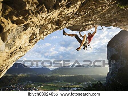 Stock Photography - "Freeclimber with helmet climbing on a rock face, Martinswand, gallery, Innsbruck, Tyrol, Austria, Europe". Fotosearch