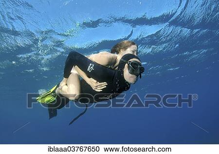 "Freediver giving woman a piggyback, Symi, Aegean Sea, Greece, Europe" View Large Photo Image Stock Image - "Freediver giving woman a piggyback, Symi, Aegean Sea, Greece, Europe". Fotosearch