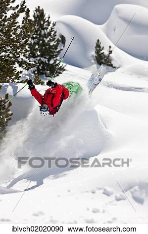 Stock Image - "Freerider, skier flipping, snowy landscape, northern Tyrol, Austria, Europe". Fotosearch