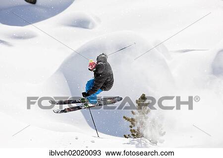 Stock Image - "Freerider, skier jumping, snowy landscape, northern Tyrol, Austria, Europe". Fotosearch