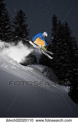 Stock Image - "Freerider, skier jumping, snowy landscape, northern Tyrol, Austria, Europe". Fotosearch