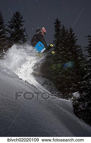 Stock Photo - "Freerider, skier jumping, snowy landscape, northern Tyrol, Austria, Europe". Fotosearch