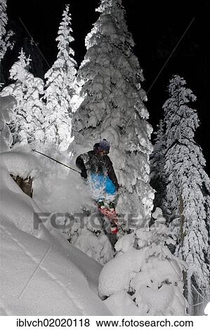 Stock Photo - "Freerider, skier jumping, snowy landscape, northern Tyrol, Austria, Europe". Fotosearch