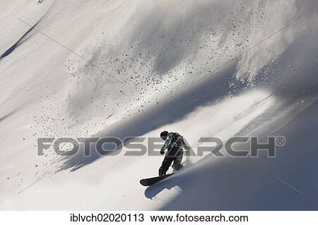 Stock Image - "Freerider, snowboarder, snowy landscape, northern Tyrol, Austria, Europe". Fotosearch